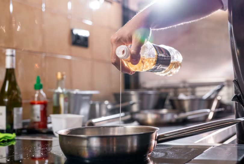 Pouring Cooking Oil into Pan